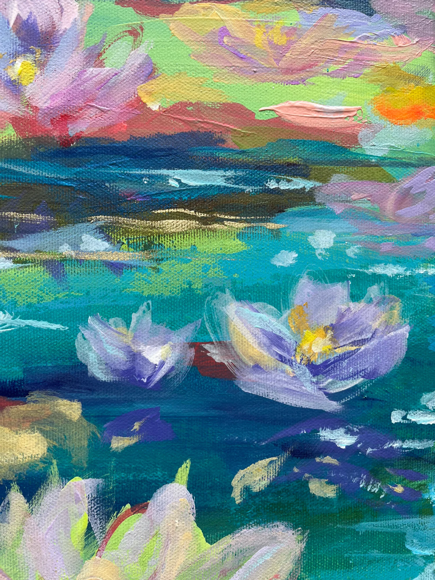 Close detail: lilac and violet lilies on deep teal water, under a band of green and coral reflections