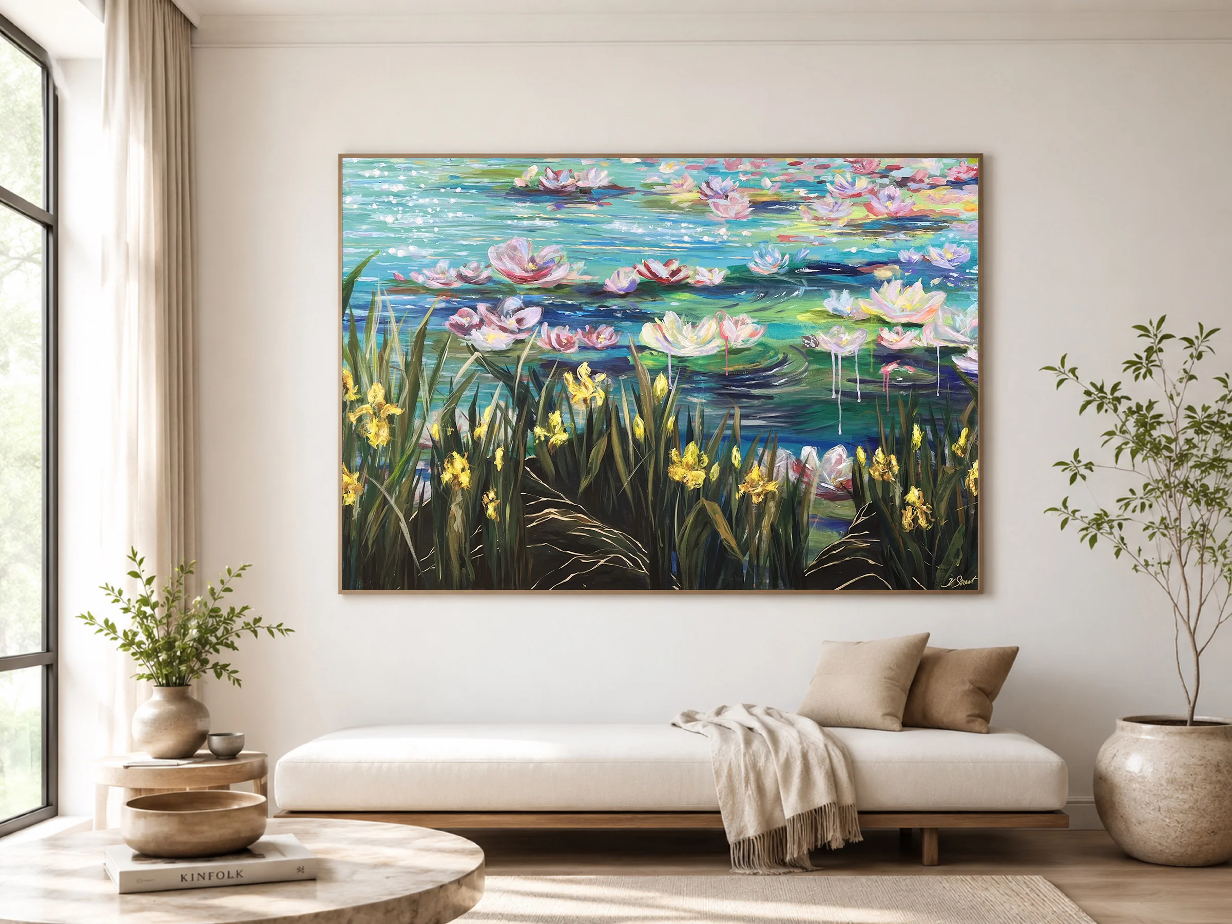 The painting Wild Flowers, framed in pale wood, filling the wall above a low daybed in a calm, sunlit room